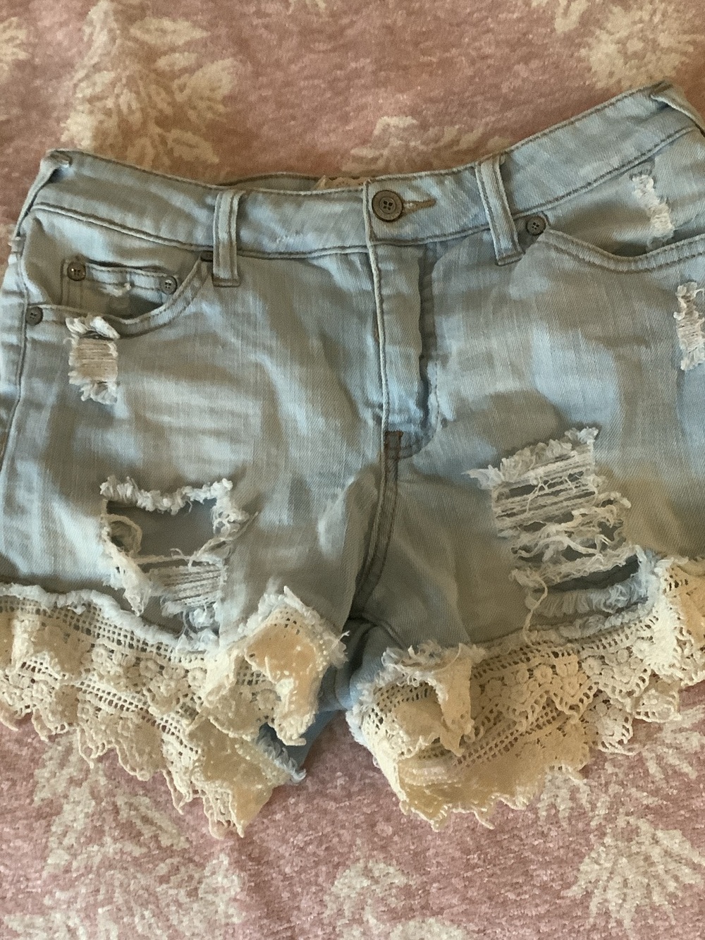 Altar'd State Light Blue Distressed Denim Shorts with Cream Lace Trim